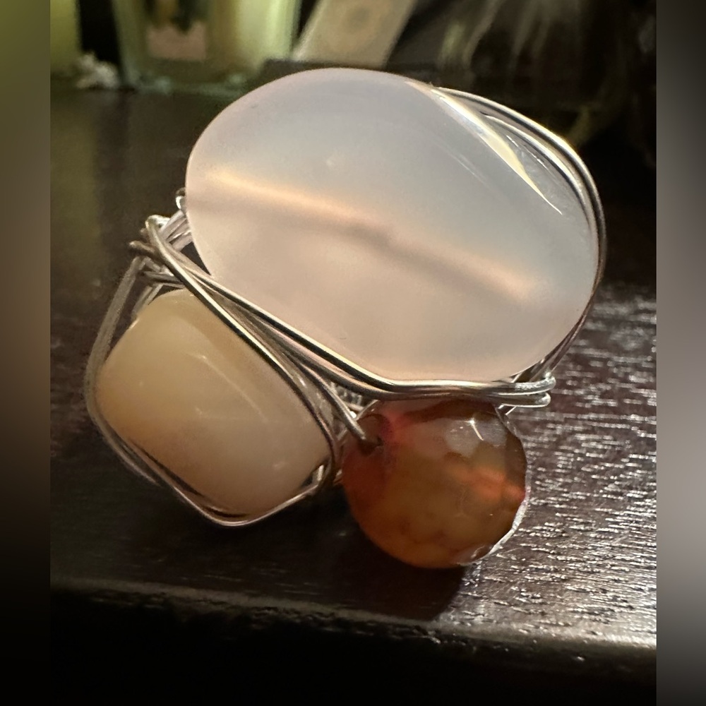Rich, adjustable one of a kind multi stoned ring